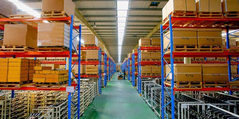 An inspector examining a product on a production line.